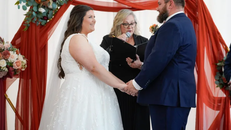 Wedding ceremony: couple with officiant