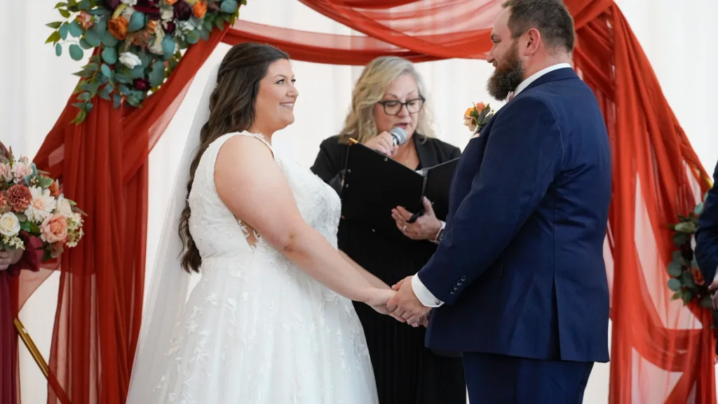Wedding ceremony: couple with officiant